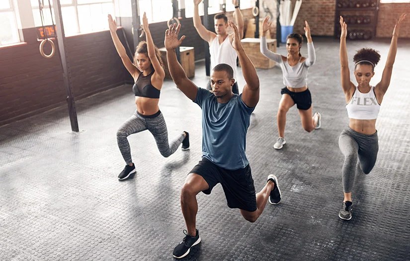 Group fitness session doing lunges together