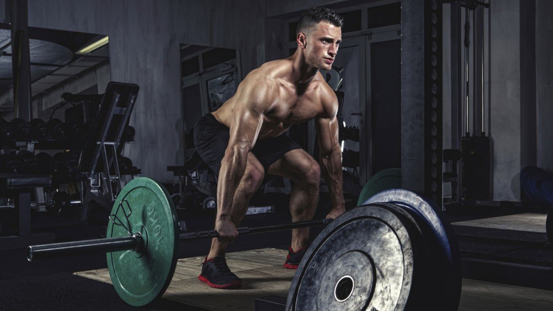 Athlete performing a heavy barbell deadlift